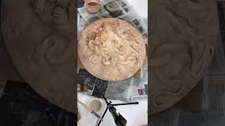 Time lapse of the application of a ceramic slip patina to the plaster cast.