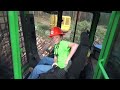 11 year old phillip loading a log truck with a john deere 437d