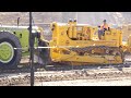 Caterpillar D9 Series E Bulldozer pushing a Euclid 16TDT Motor Scraper at Wheels at Wanaka 2023