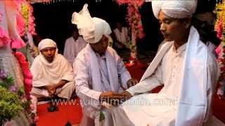 Manipuri groom performs pre-wedding rituals while bride gets ready