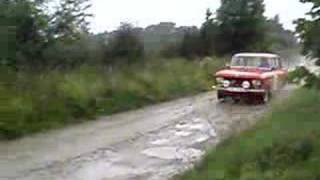 red moskvich going fast on gravel