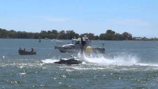 Men flying over water at Toronto Fly Board 2014