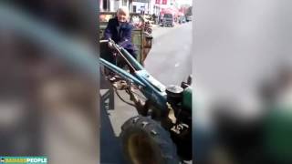 Badass 80 year old granny wowing onlookers by showing off her tractor driving skills