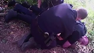 Bodycam shows officer hold gun to unarmed man's head