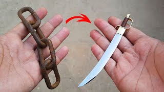 RUSTED IRON CHAIN FORGED INTO A MINI SWORD