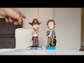 bobble heads dexter et rick grimes en action