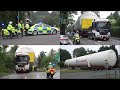 Police escort a large oxygen tanker through suburban streets