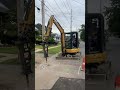 cat 304 excavator with cat b6 hammer jackhammering asphalt