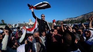 Pro-Assad supporters rally against US, UK and France after Syria air strikes | ITV News