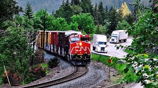 Trains And Trucks Following The Trans-Canada Hwy In British Columbia