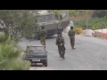 israeli soldier knocked over by rolling tire