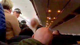 Passenger from hell goes on racist tirade before being escorted off plane | SWNS