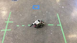 EV3 robot picking up a block.