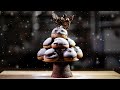 The Christmas tree of chocolate sweets -Profiteroles, cookies, cake-