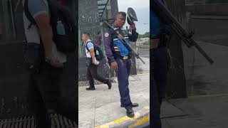 Philippines guard with big gun stares me down in Manila Philippines #boracay #travel #bgc #manila