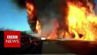 Flames engulf highway in China after gas tanker overturns - BBC News