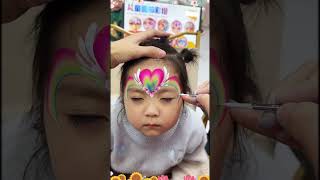 Magical and colorful, this Rainbow Unicorn face painting 🦄🌈