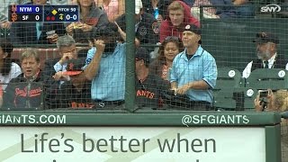 A pair of umpires call game from stands