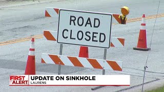 Businesses approved to re-open after crews repair sinkhole
