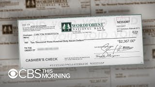 Fake check scams "exploding epidemic," new report says