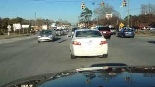 How to turn left at an intersection when there is oncoming traffic and no green arrow.