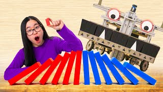 HUMAN vs. ROBOT Domino Building Machine! (w/ Mark Rober)