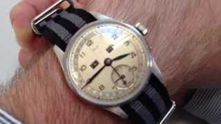 UNITAS / AUGUSTE REYMOND, circa 1950 - A rare steel and nickel plated triple calendar wristwatch