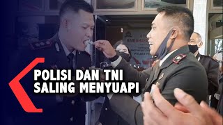 Polisi dan TNI saling menyuapi di HUT Bhayangkara KE 74