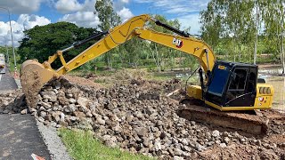 CAT 313GC is preparing the mountain rock stock.