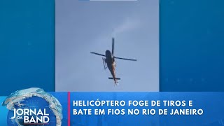 Helicóptero foge de tiros e bate em fios no Rio de Janeiro | Jornal da Band