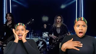 REACTED TO THIS ASTONISHING BAND THE WARNING PERFORMING CHOKE