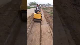 Walk behind vibratory road roller