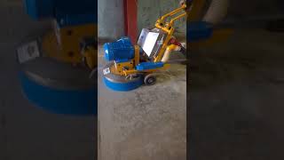 dfg700 grinder with button plates fitted and dust control on factory floor removing paint