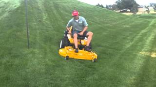 Walker zero-turn mower effortlessly mowing on 25 degree slope