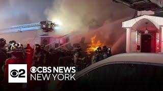 Video shows Queens house explosion as NYPD officers try to enter