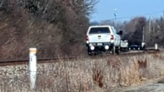 Hi-railer crossing Millsdale Ave while Eastbound blows for NS a half-mile to the east on Dayton Dist