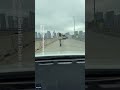 woman rides scooter on miami highway