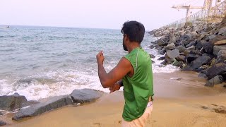 A Fisherman fishing on Seashore