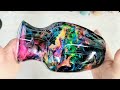 Colorful rainbow alcohol ink and epoxy resin on a vase on a cup turner