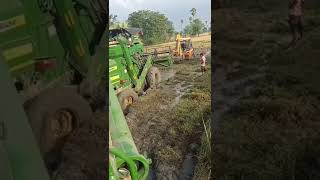 JCB Helping combined 4 wheel harvester from mud in fields #harvest #telugu #harvester 🌾☀️🌟