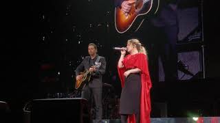 Kelly Clarkson gets surprised by her husband on stage while she performs "piece by piece".
