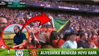 HUYU HAPA MTANZANIA ALIYEPEPERUSHA BENDERA KATIKA MCHEZO WA MAN CITY VS MAN UNITED JIJINI LONDON