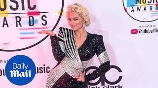 Bebe Rexha blows kiss in sparkly number on 2018 AMAs red carpet