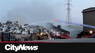 Crews battle fire at metal recycling facility in SE Calgary