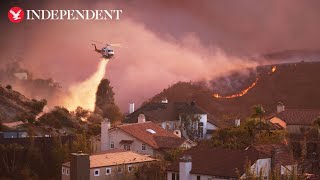 Helicopters battle Palisade fire as flames burn on Santa Monica mountains