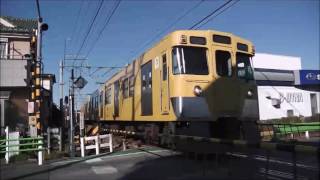 Train of Seibu Kokubunji line passing a railroad crossing in high speed