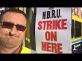 henry mckean speaks with a dublin bus driver on the picket line