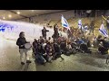 Anti-government protesters block roads and scuffle with Israeli security forces in Tel Aviv