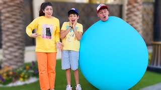 Jason and Alex wear a fun giant balloon challenge