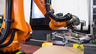 KUKA KR QUANTEC loading and unloading a DMG Mori machine tool